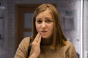 Woman experiencing dental aligner pain