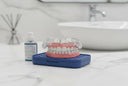 Here's an image of a custom-fit night guard designed for denture wearers.
