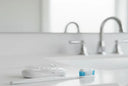 A tooth brush and a night guard on a counter , showing oral hygiene 
