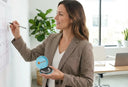 A modern professional checking a calendar while holding a clear aligner case