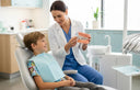 Child receiving orthodontic consultation for early braces evaluation