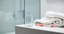 Bright, modern bathroom scene with a transparent retainer