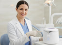 Dentist recommending Petal Ultrasonic Cleaner to patient.