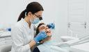 Periodontist checking gum health during dental exam