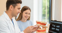 Orthodontist showing proper nighttime aligner fitting