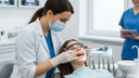 Orthodontist examining retainer fit to prevent gum notches