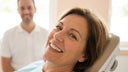 A confident adult patient smiling naturally in a dental chair