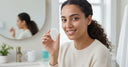 Happy patient showing NewSmile aligner tray