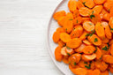 Sliced and cooked soft carrots on a plate as a braces-friendly option