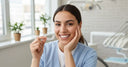 Patient showing aligned teeth with retainer