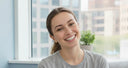 Happy patient using professional NewSmile clear aligners