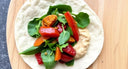 Soft veggie wrap with hummus and roasted peppers—aligner-friendly lunch.