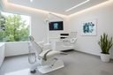 Dental chair in a clinic with white walls