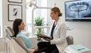 Dentist explaining root canal therapy to a patient in a modern dental clinic
