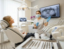 realistic dental clinic scene showing a calm adult patient seated in a modern dental chair